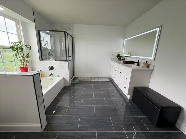 a bathroom with a sink toilet and mirror
