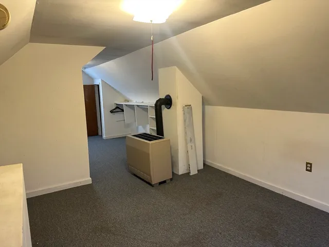 a view of entryway and kitchen