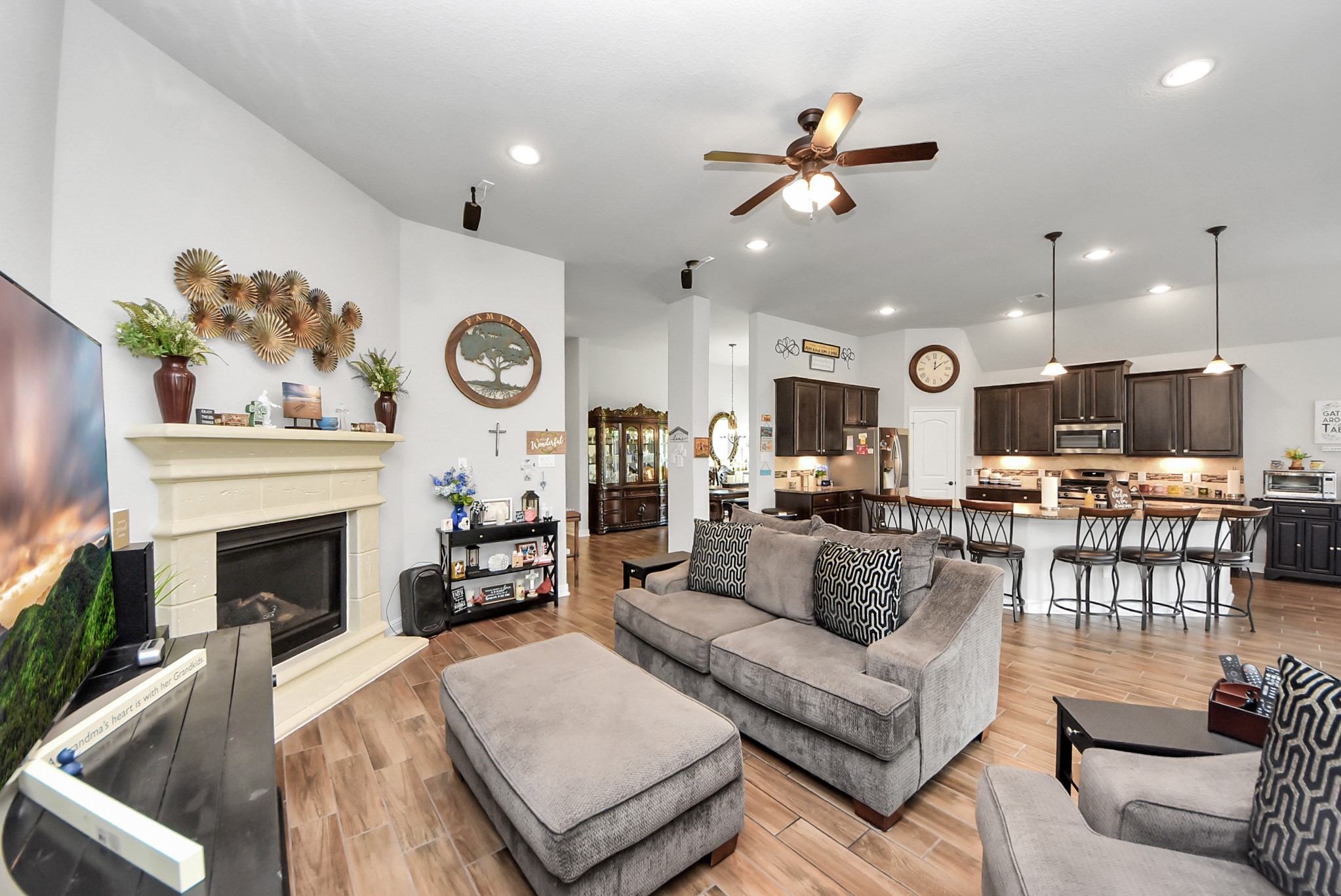 24503 Eucalyptus Way Spring, TX 77373 - Photo 3 of 27 a living room with furniture kitchen view and a fireplace
