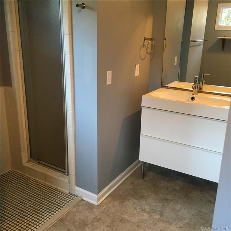 3719 Park Road Charlotte, NC 28209 - Photo 11 of 14 a bathroom with a sink and a mirror