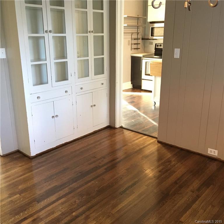 3719 Park Road Charlotte, NC 28209 - Photo 7 of 14 an empty room with wooden floor and windows