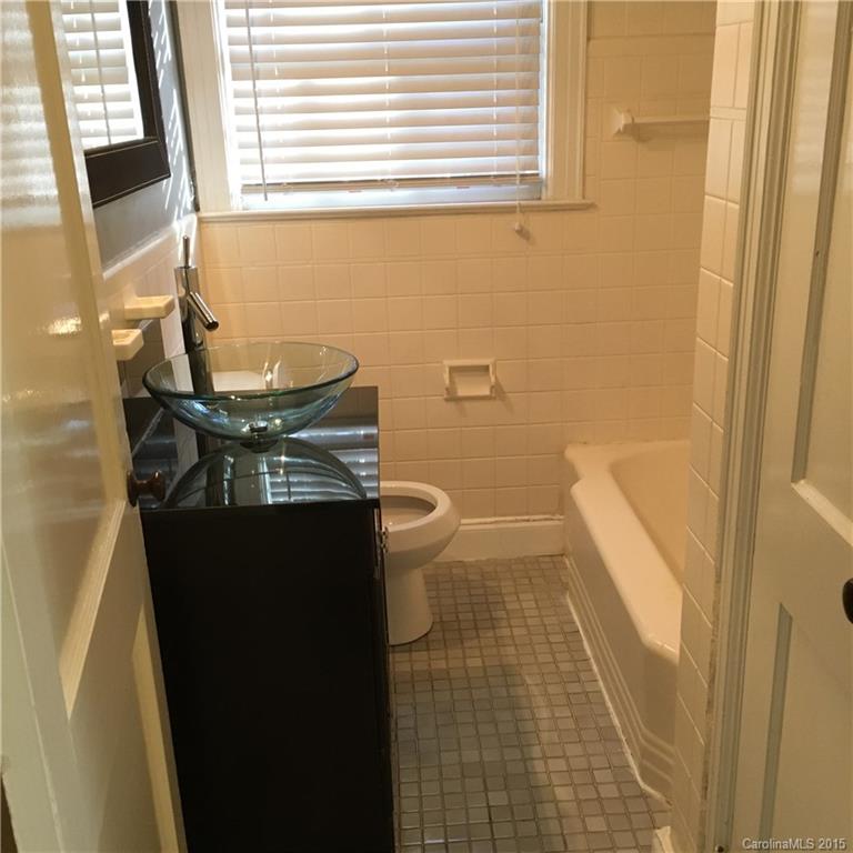 3719 Park Road Charlotte, NC 28209 - Photo 9 of 14 a bathroom with a sink a toilet and a shower