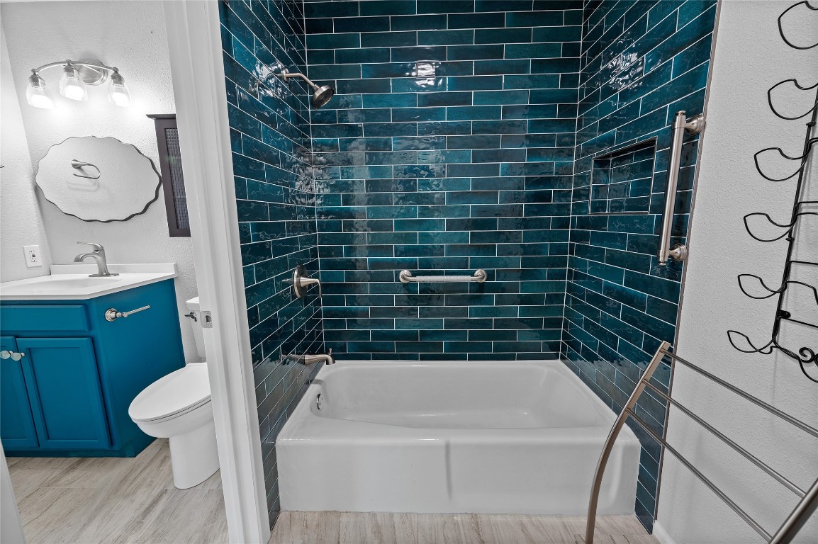 11301 Jollyville Road, Unit B3 Austin, TX 78759 - Photo 13 of 21 a bathroom with a sink a toilet and shower