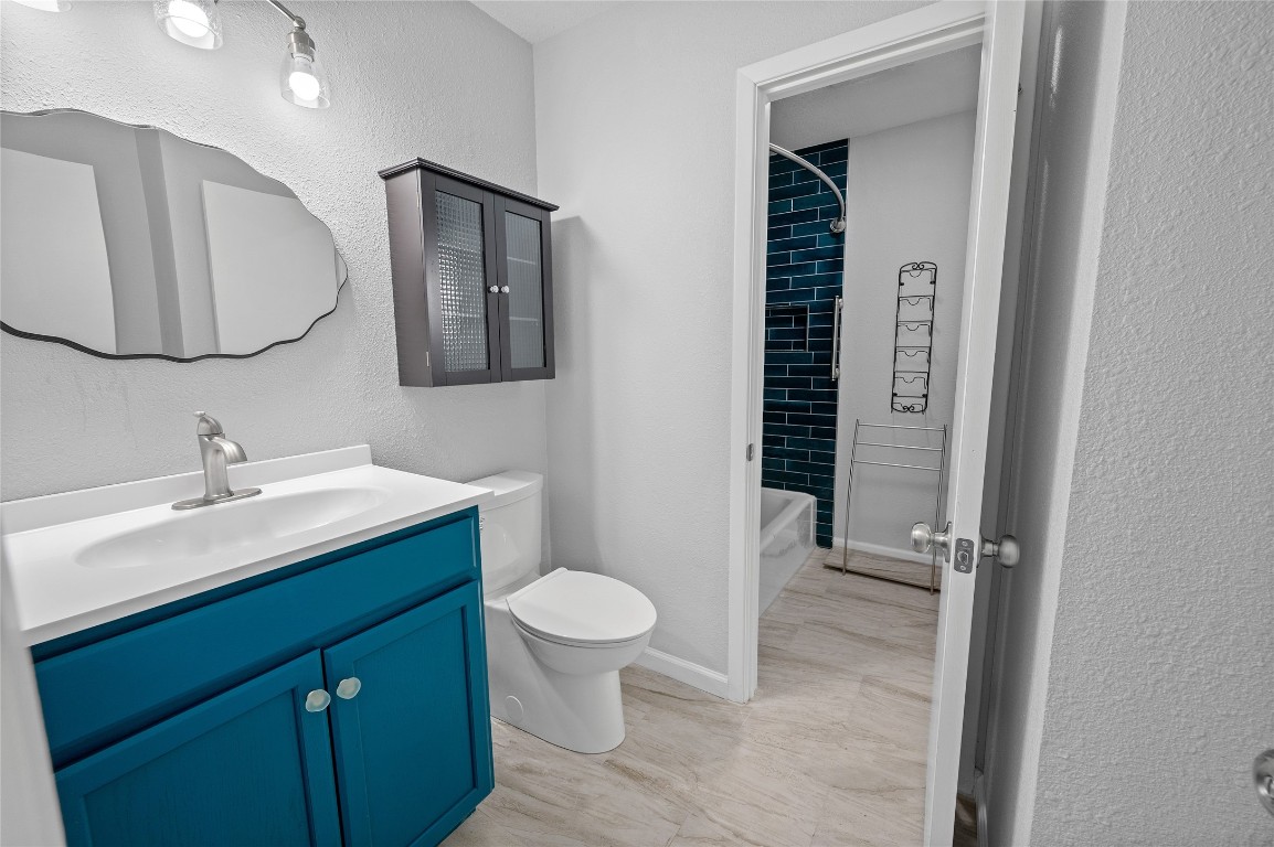11301 Jollyville Road, Unit B3 Austin, TX 78759 - Photo 14 of 21 a bathroom with a toilet sink double vanity and mirror