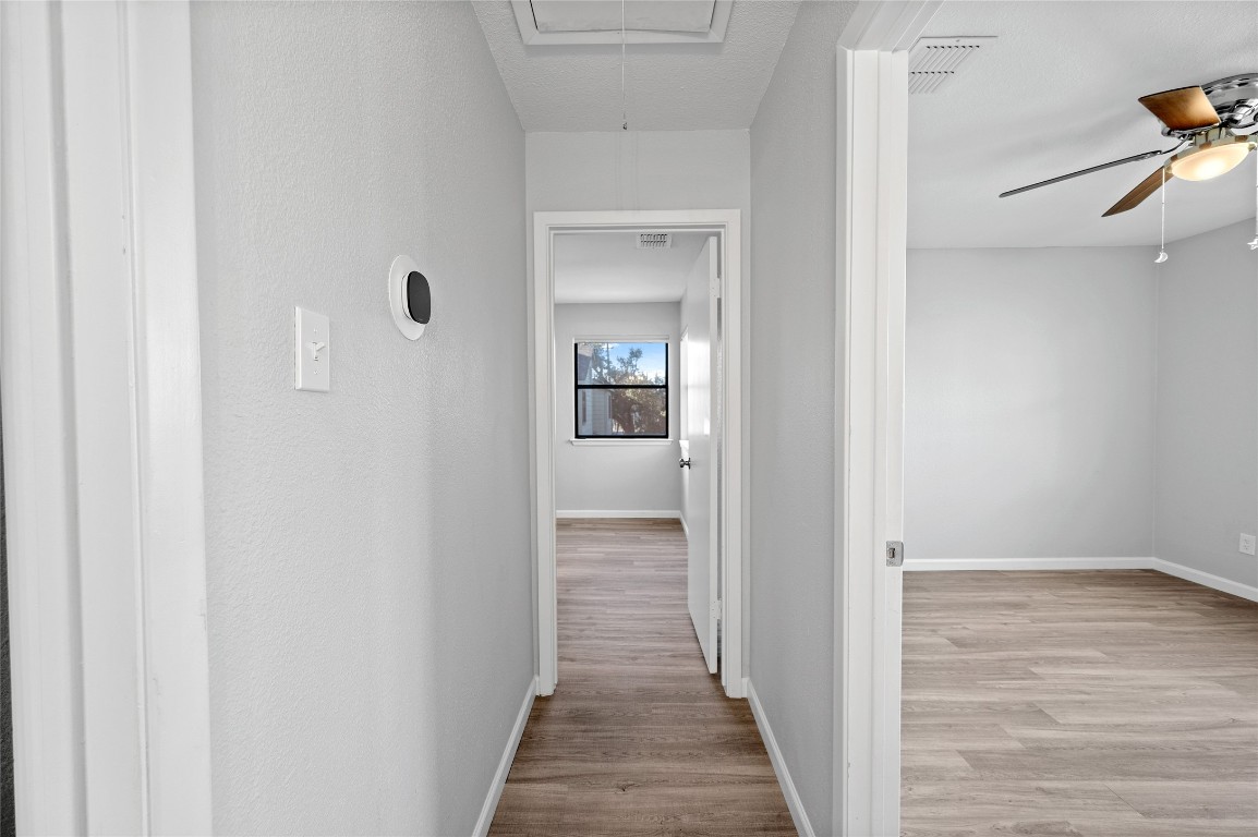 11301 Jollyville Road, Unit B3 Austin, TX 78759 - Photo 17 of 21 a view of a hallway with wooden floor