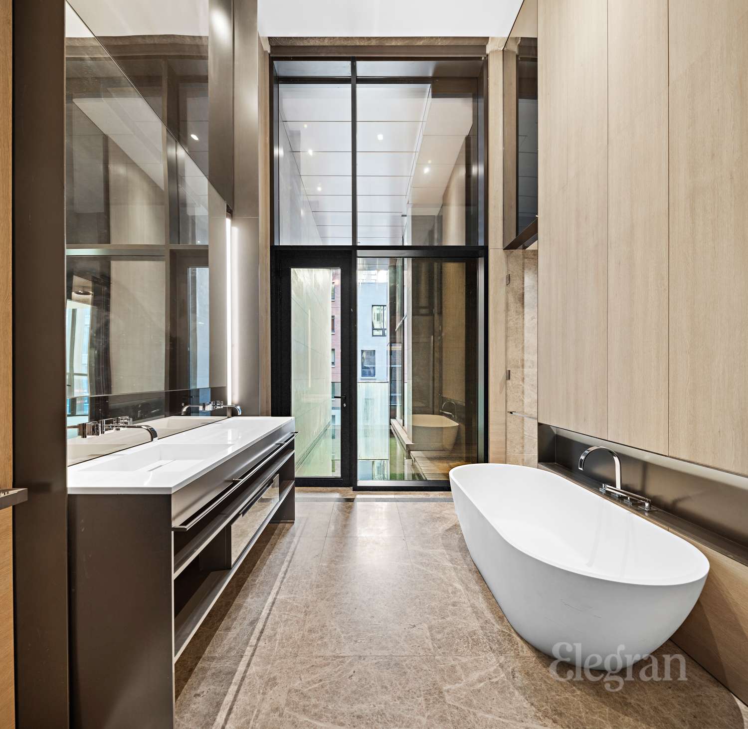 522 West 29th Street, Unit B3 Manhattan, NY 10001 - Photo 8 of 19 a bathroom with a double vanity sink and mirror