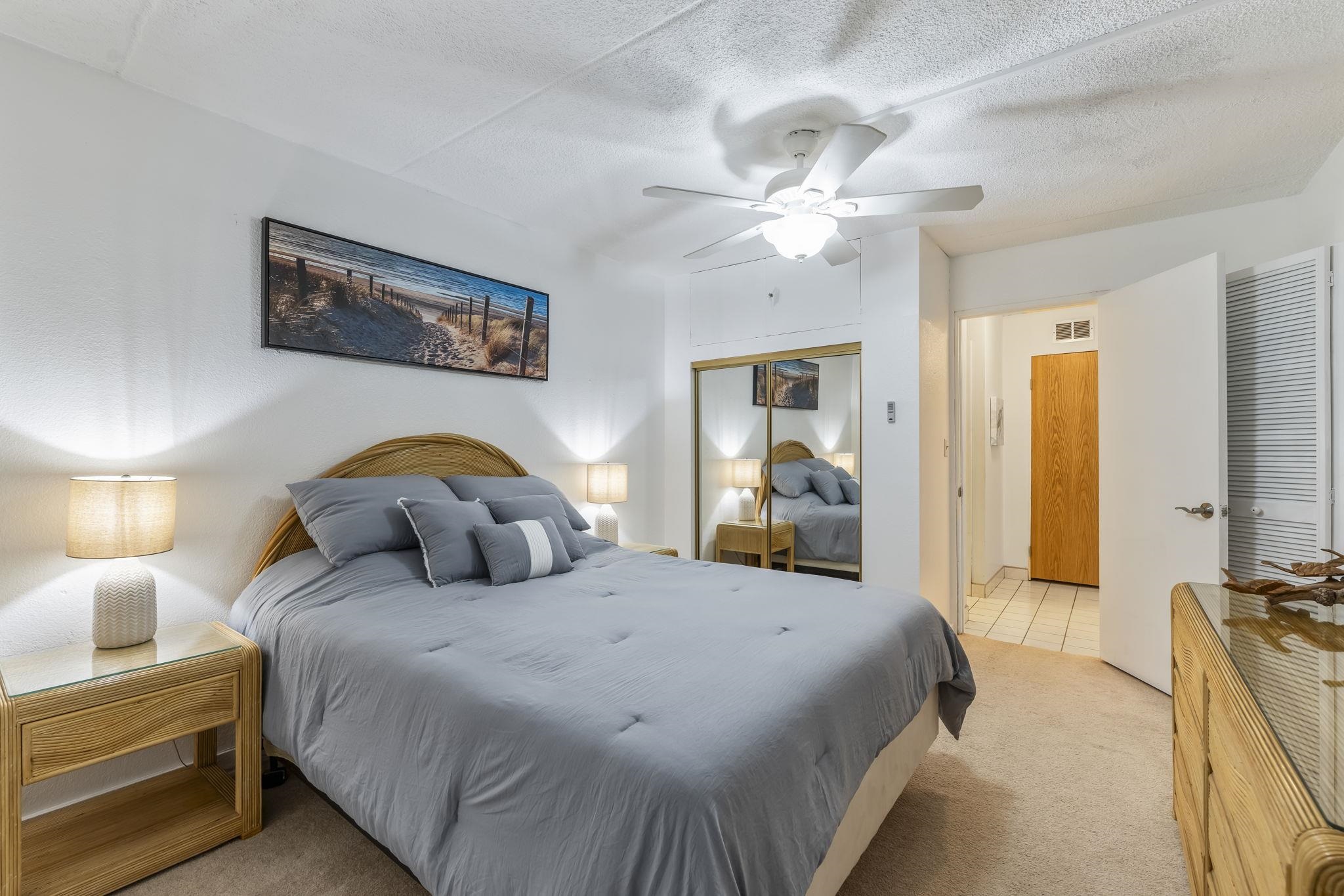 2531 South Kihei Road, Unit DG10 Kihei, HI 96753 - Photo 14 of 31 a bedroom with a bed and ceiling fan