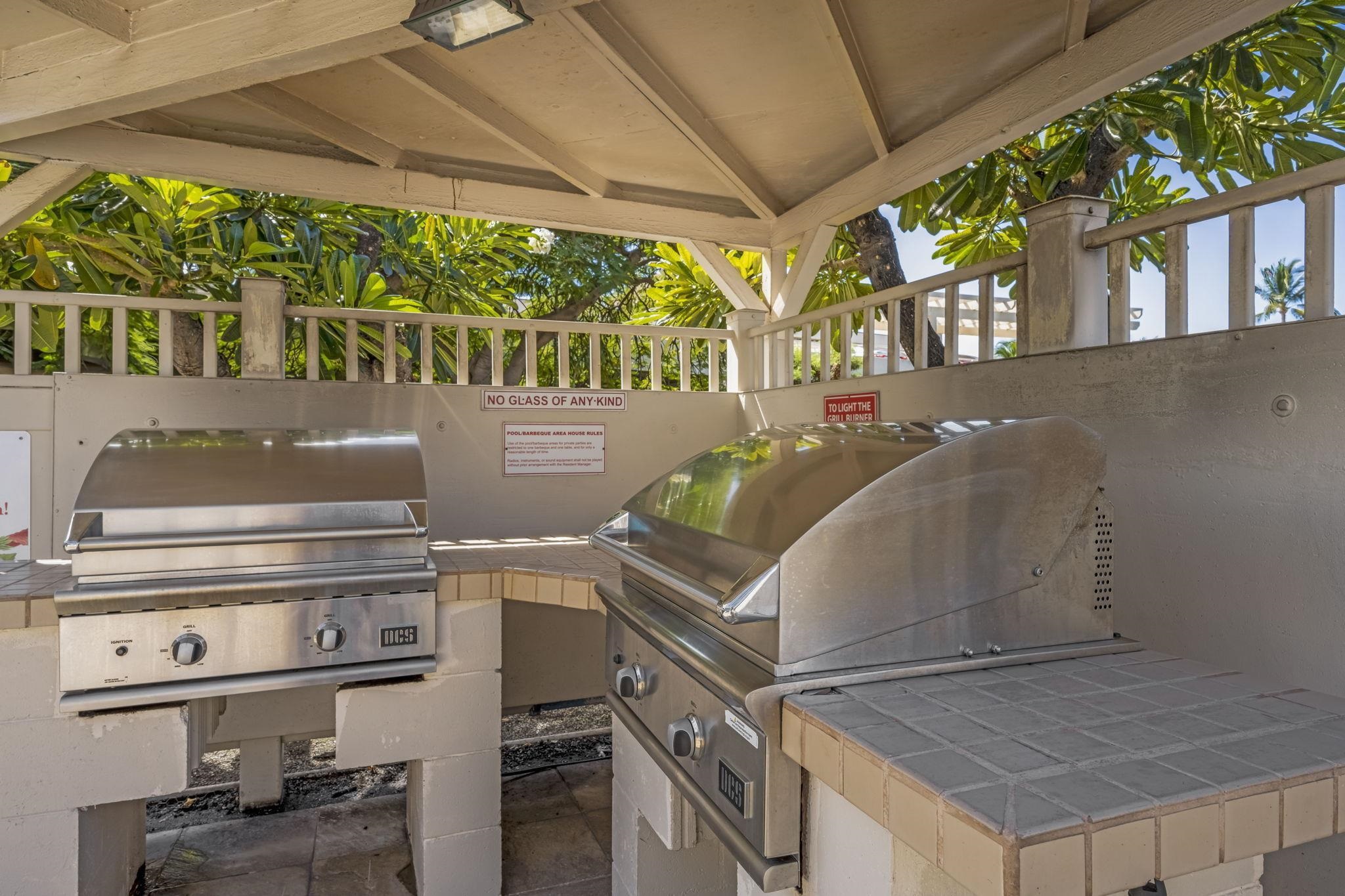 2531 South Kihei Road, Unit DG10 Kihei, HI 96753 - Photo 24 of 31 a view of a patio with table and chairs a barbeque