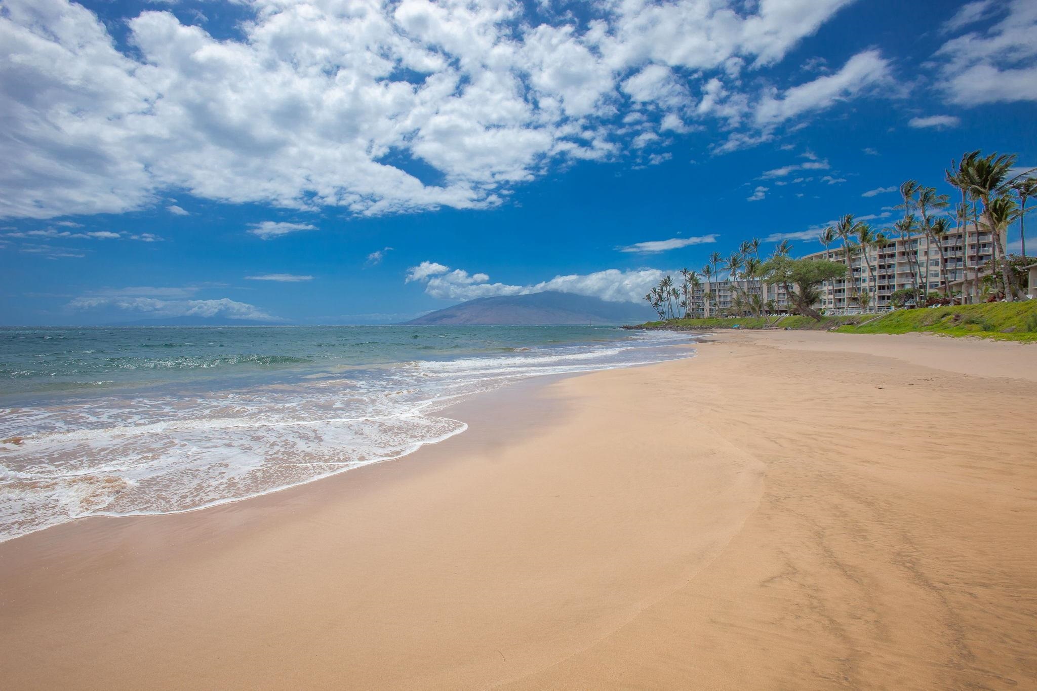 2531 South Kihei Road, Unit DG10 Kihei, HI 96753 - Photo 29 of 31 a view of a lake with a building in the background
