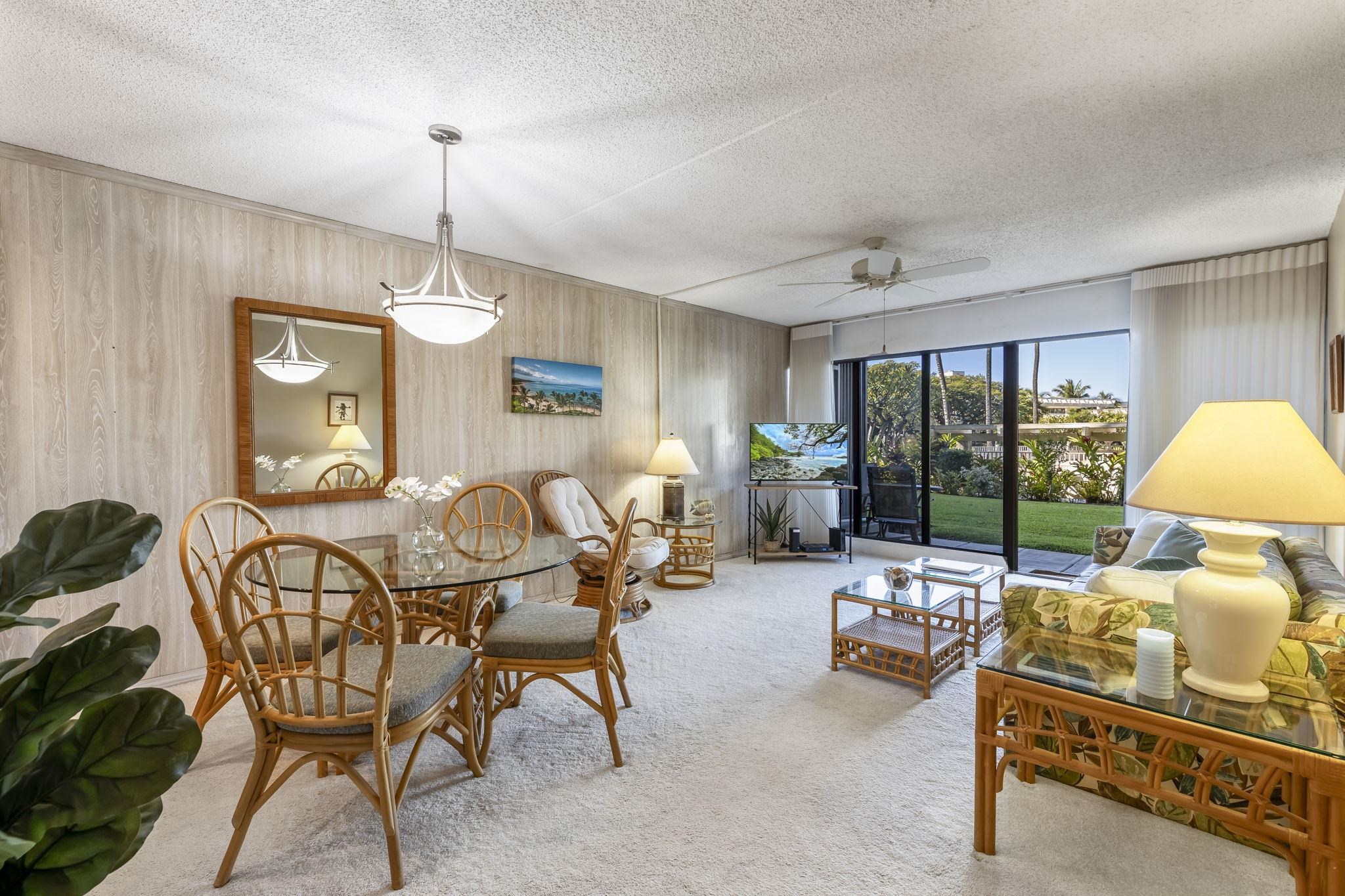 2531 South Kihei Road, Unit DG10 Kihei, HI 96753 - Photo 7 of 31 a living room with furniture and a chandelier