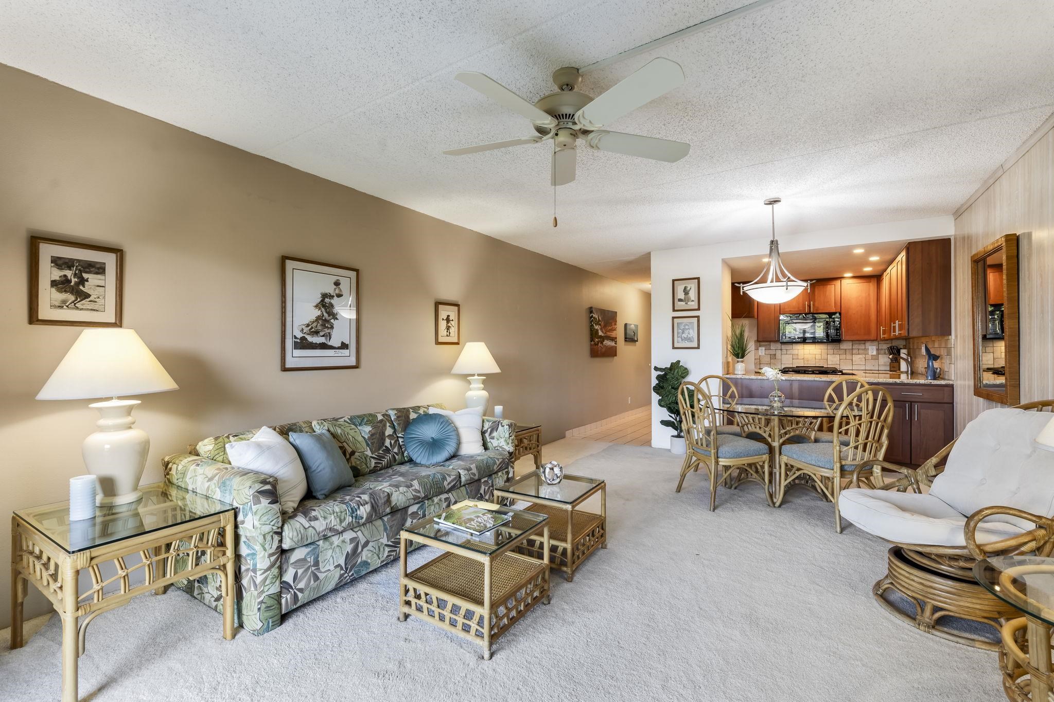 2531 South Kihei Road, Unit DG10 Kihei, HI 96753 - Photo 8 of 31 a living room with furniture and a chandelier