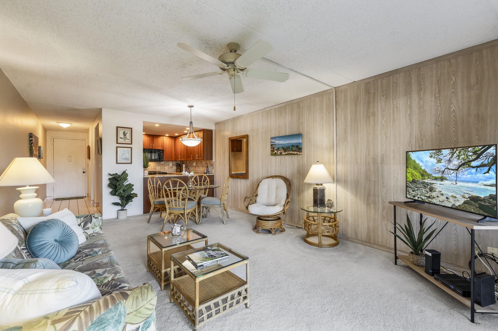 2531 South Kihei Road, Unit DG10 Kihei, HI 96753 - Photo 9 of 31 a living room with furniture a window and a flat screen tv