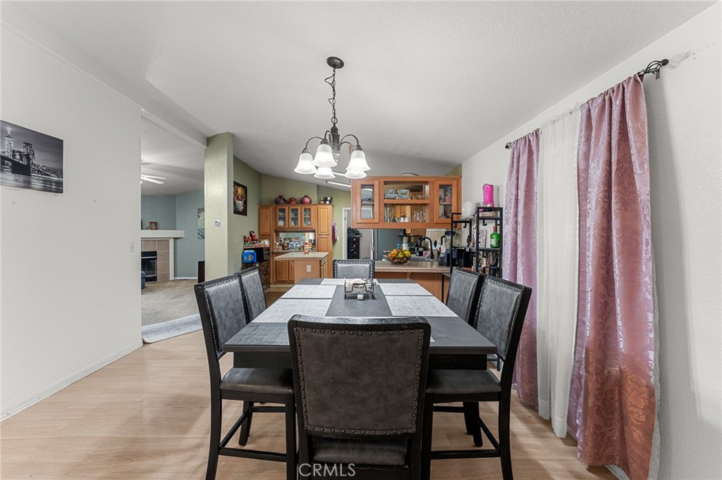 138 Sir Damas Drive Riverside, CA 92507 - Photo 11 of 36 a view of a dining room with furniture window and wooden floor