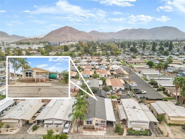 an aerial view of residential houses and outdoor space
