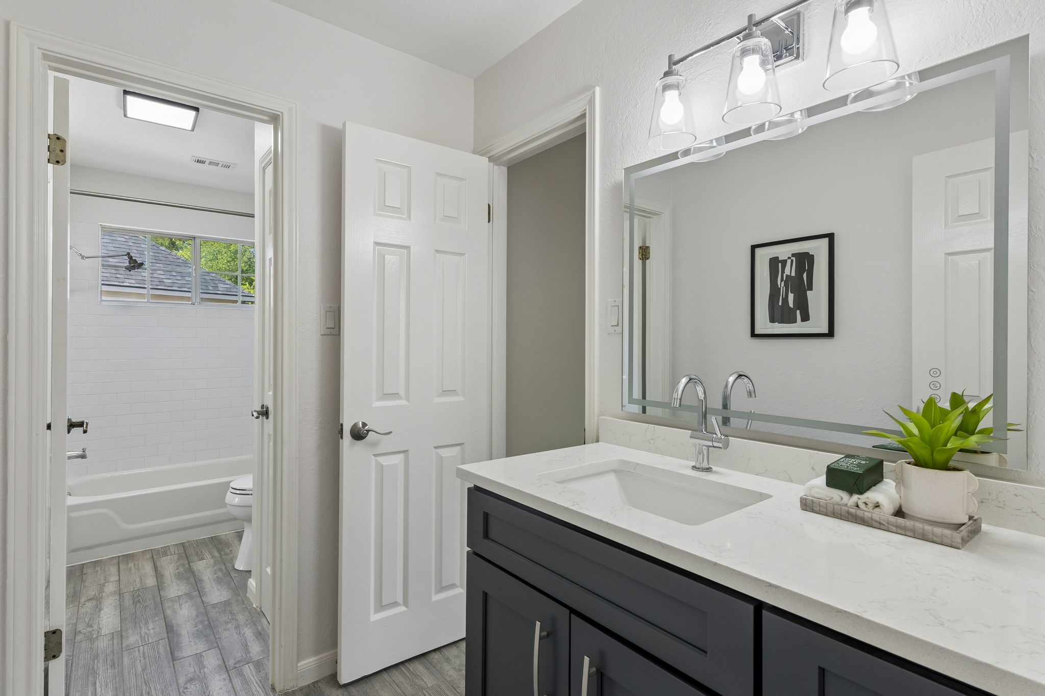 6557 Needham Lane Austin, TX 78739 - Photo 27 of 37 Thoughtfully renovated upstairs bath serving the secondary bedrooms and bonus room