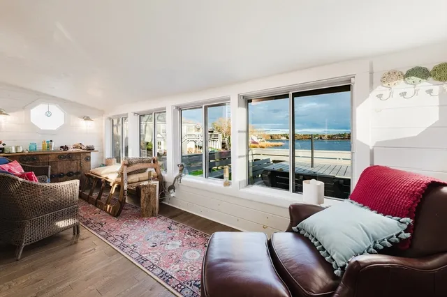 a kitchen with stainless steel appliances a sink stove and cabinets