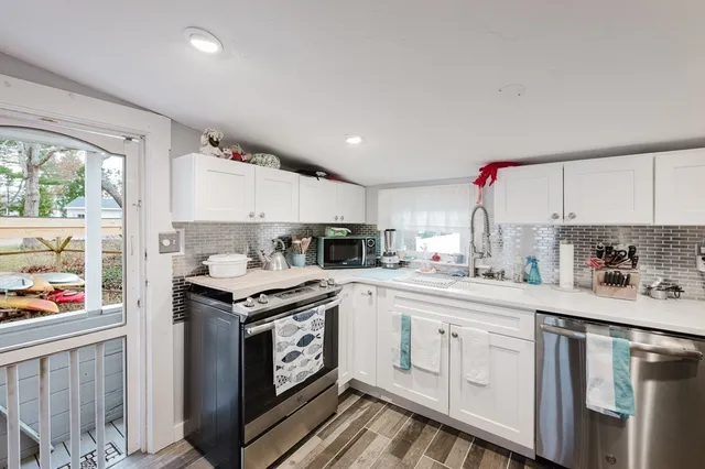 a bedroom with a bed and chair