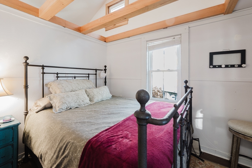 4 Ross Avenue Wareham, MA 02571 - Photo 30 of 39 a bedroom with a bed and a chair