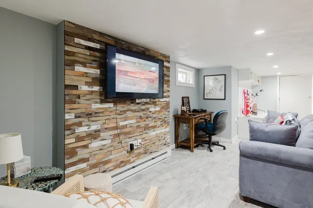 a bedroom with a bed and a mirror