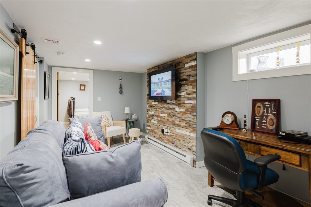 4 Ross Avenue Wareham, MA 02571 - Photo 34 of 39 a living room with furniture and a flat screen tv