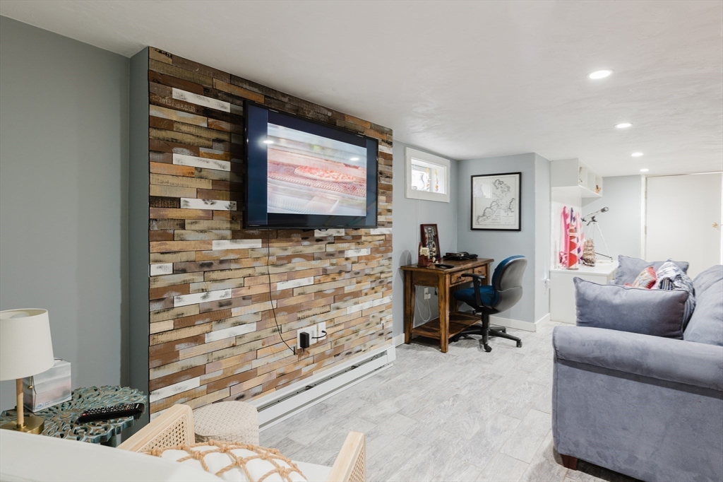 4 Ross Avenue Wareham, MA 02571 - Photo 35 of 39 a livingroom with workspace and a couch
