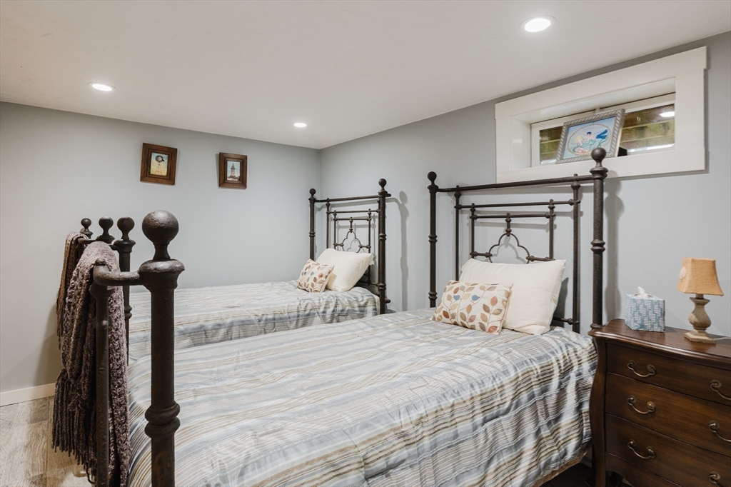 4 Ross Avenue Wareham, MA 02571 - Photo 36 of 39 a bedroom with a bed and a mirror