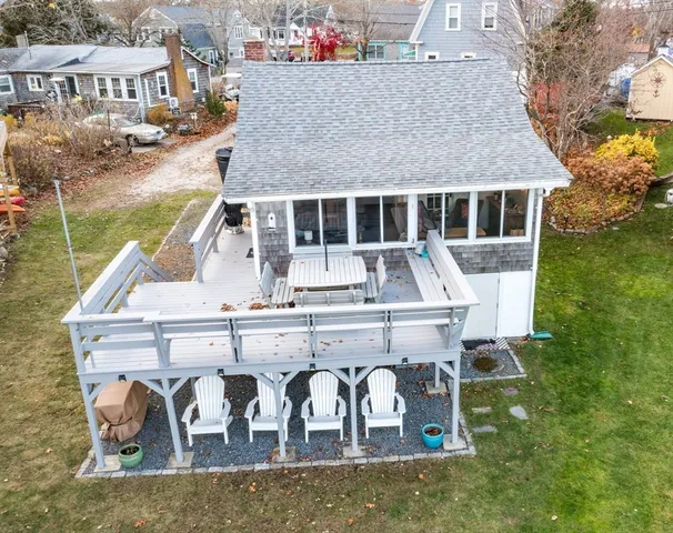 a aerial view of a house with swimming pool and sitting area