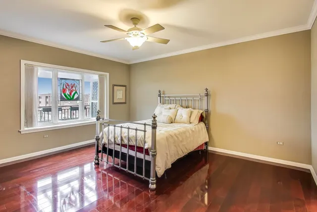 a bed room with a bed and a chandelier