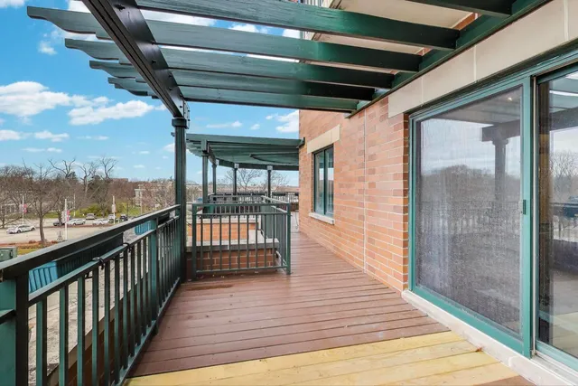 a view of balcony with wooden floor