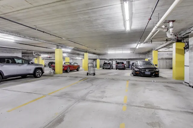 a view of parking area with car parked