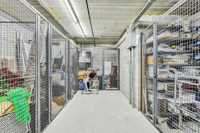 a view of a porch with a glass door and furniture