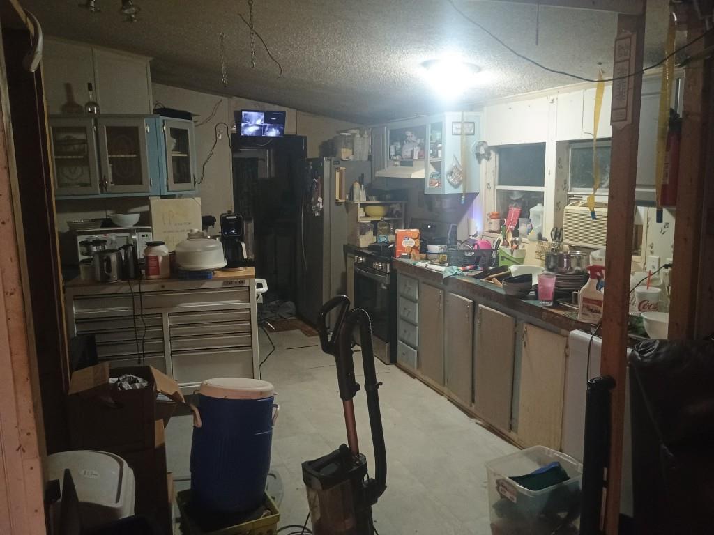 61 Lake Rd Court Ellijay, GA 30540 - Photo 5 of 14 a kitchen view of a kitchen island wooden cabinets and stainless steel appliances