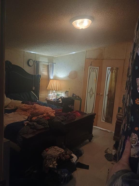 61 Lake Rd Court Ellijay, GA 30540 - Photo 9 of 14 a bedroom with a bed and window