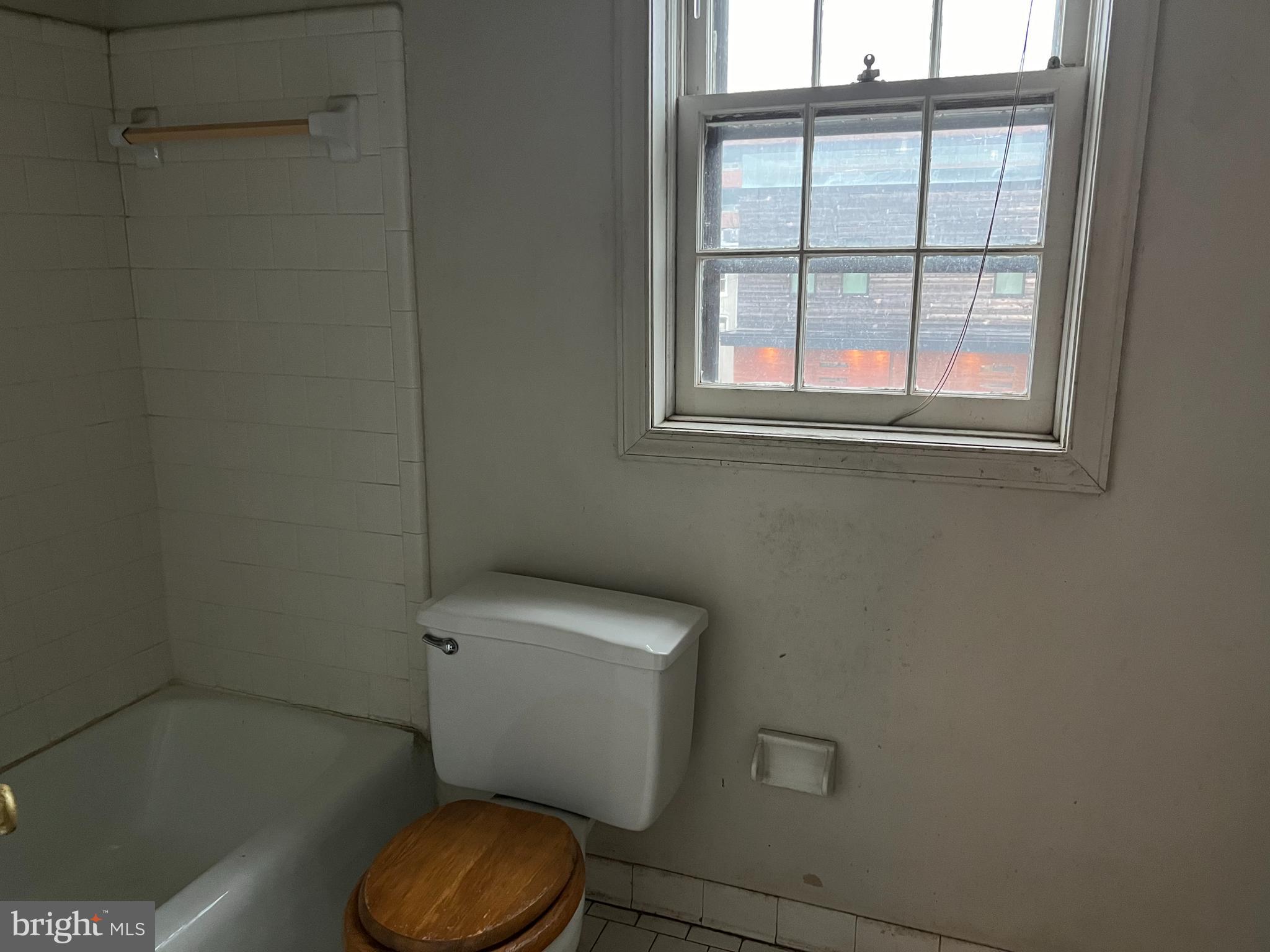 422 11th Street Southeast Washington, DC 20003 - Photo 18 of 24 a white toilet sitting next to a bathroom