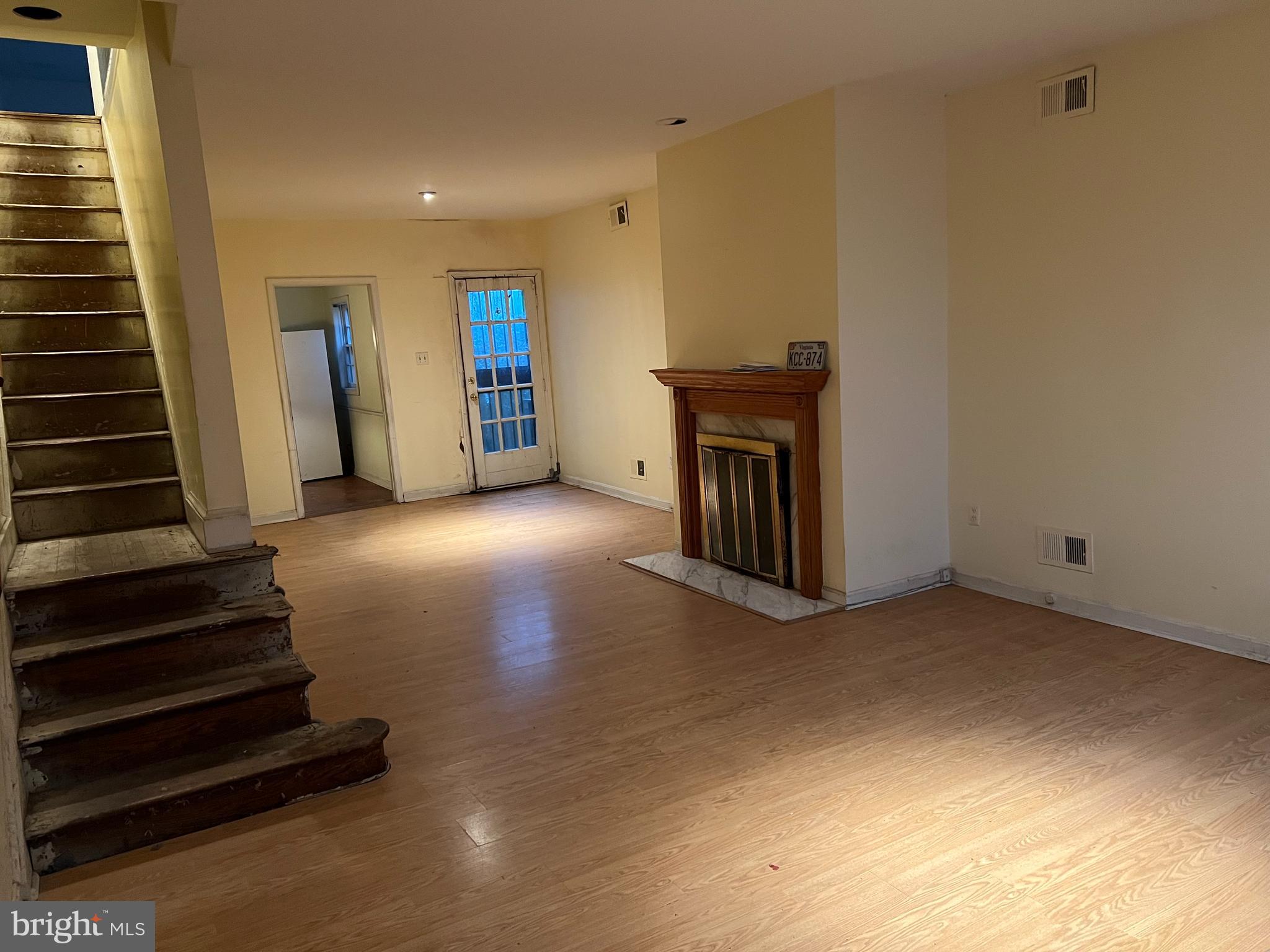 422 11th Street Southeast Washington, DC 20003 - Photo 3 of 24 a view of a livingroom with wooden floor and stairs