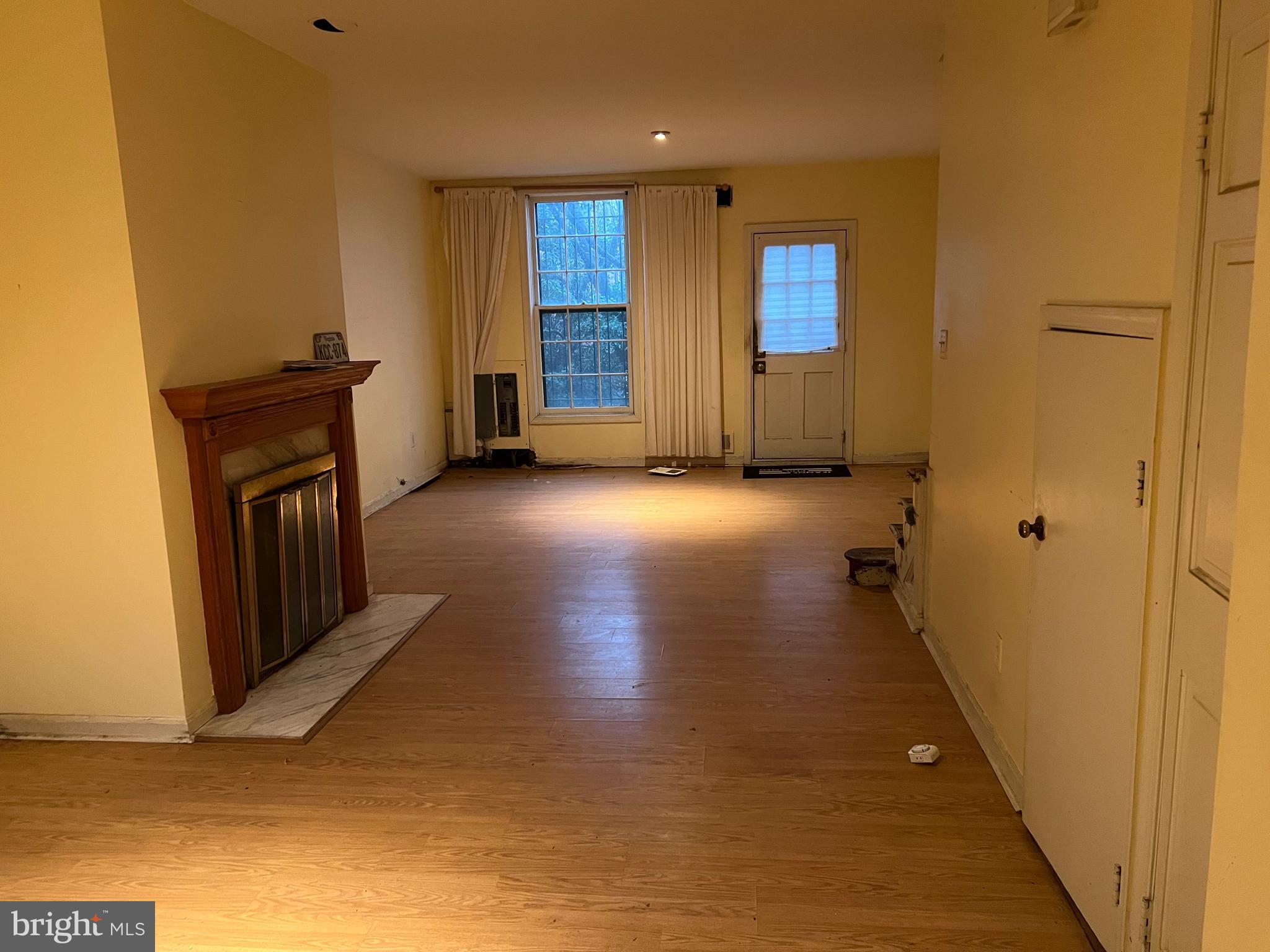 422 11th Street Southeast Washington, DC 20003 - Photo 5 of 24 a view of a hallway with wooden floor and a bathroom