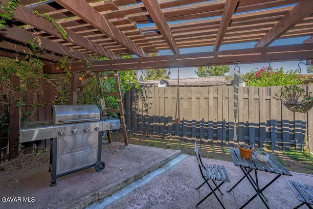 a view of yard with a patio and wooden fence