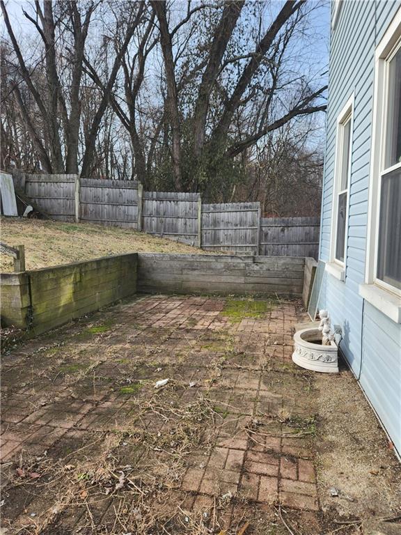 5388 Warble Street Pittsburgh, PA 15224 - Photo 5 of 14 a view of a yard with wooden fence