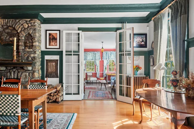 a bathroom with a toilet a sink and a mirror
