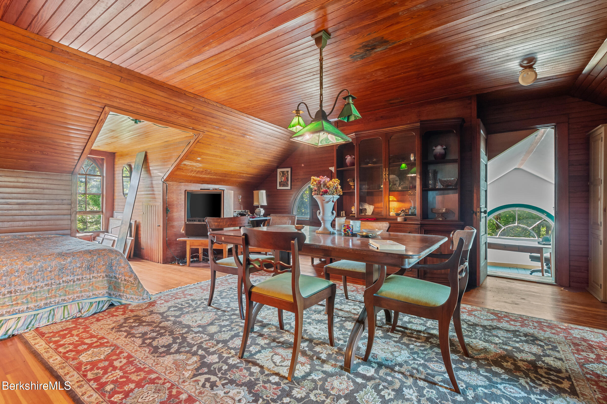 535 Main Road Monterey, MA 01245 - Photo 35 of 45 a view of a patio with a table and chairs and a barbeque