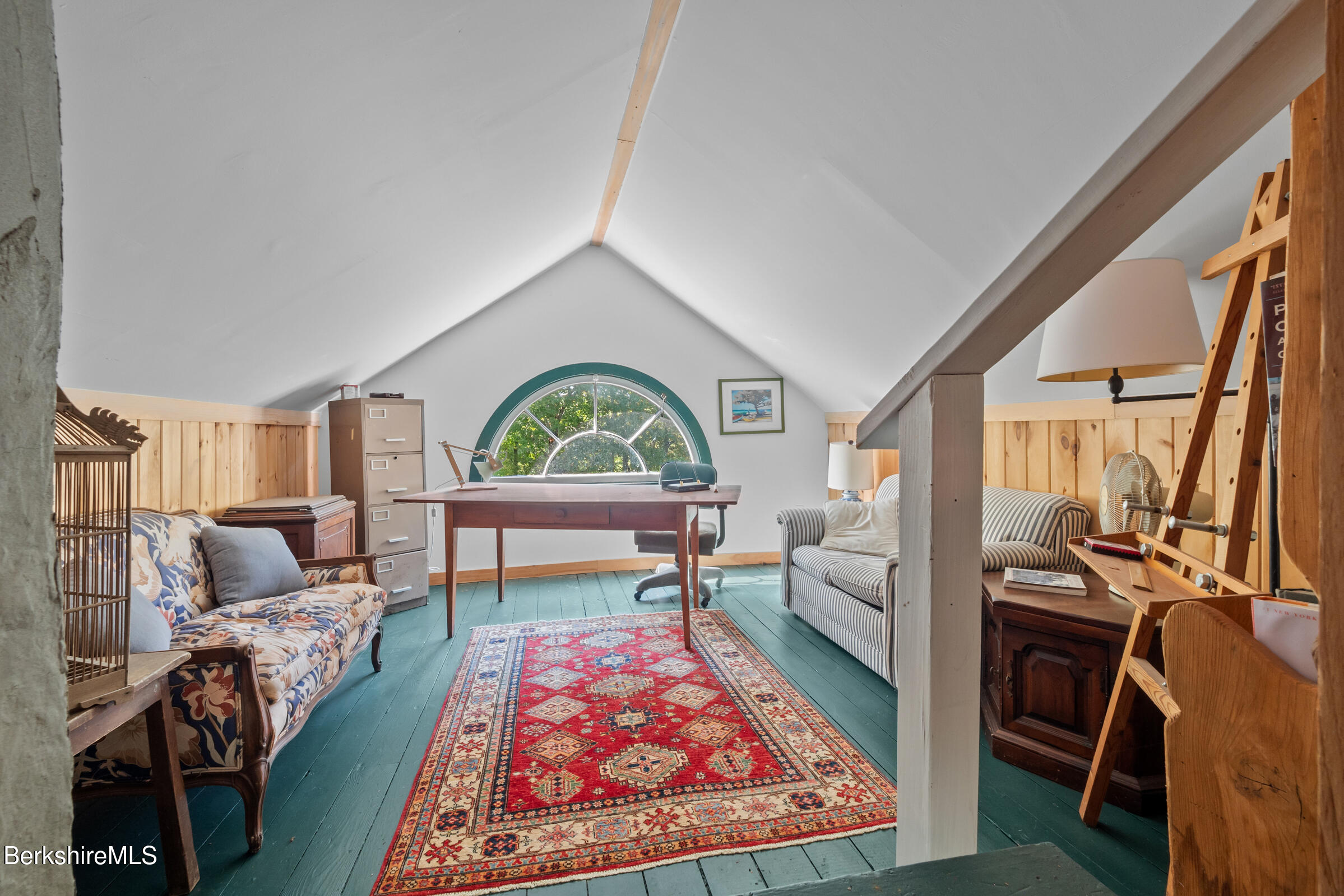 535 Main Road Monterey, MA 01245 - Photo 36 of 45 a living room with furniture a rug and a table