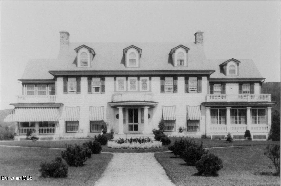 535 Main Road Monterey, MA 01245 - Photo 4 of 45 a front view of a house with garden