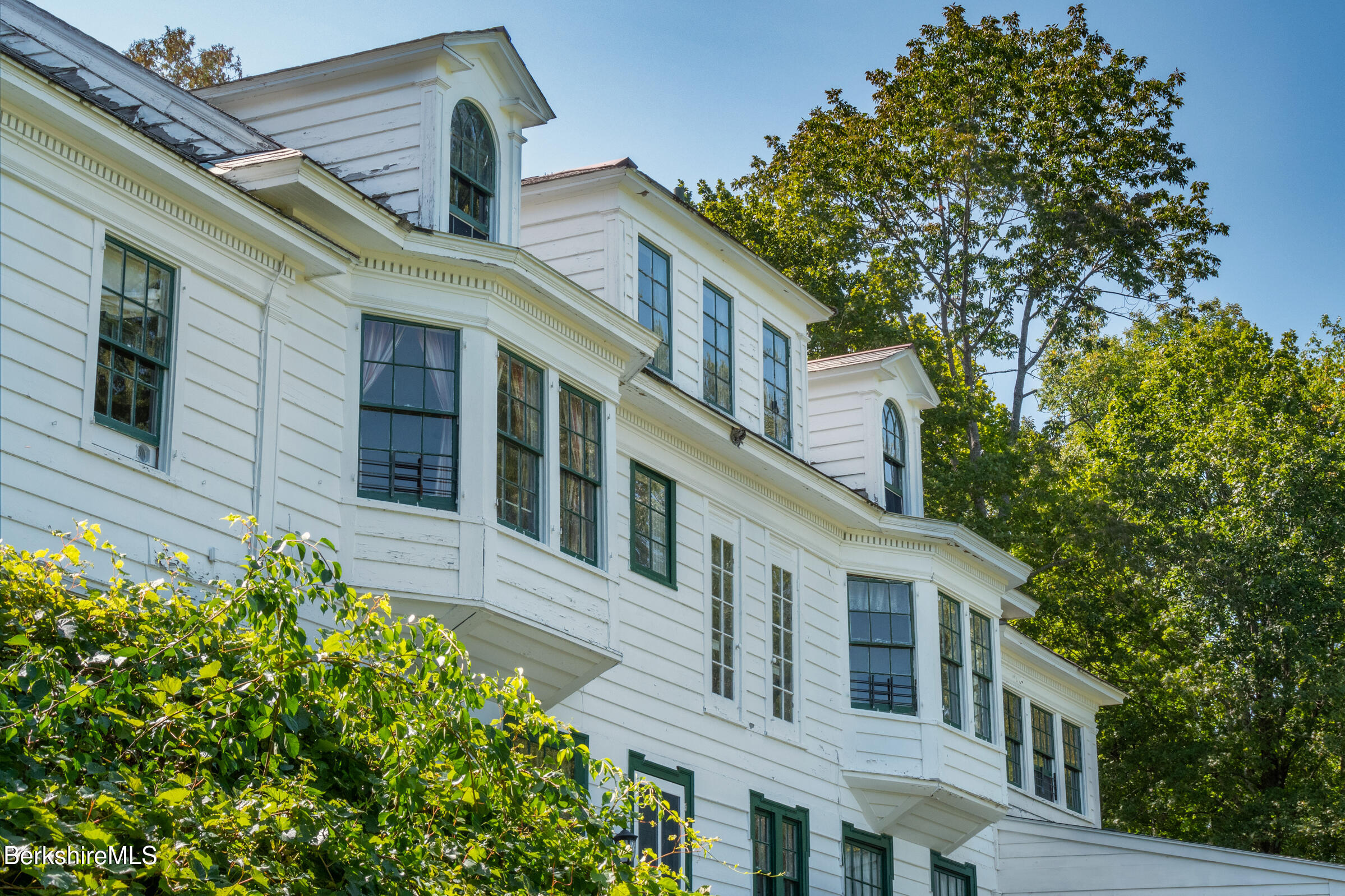 535 Main Road Monterey, MA 01245 - Photo 44 of 45 a front view of a house with a garden