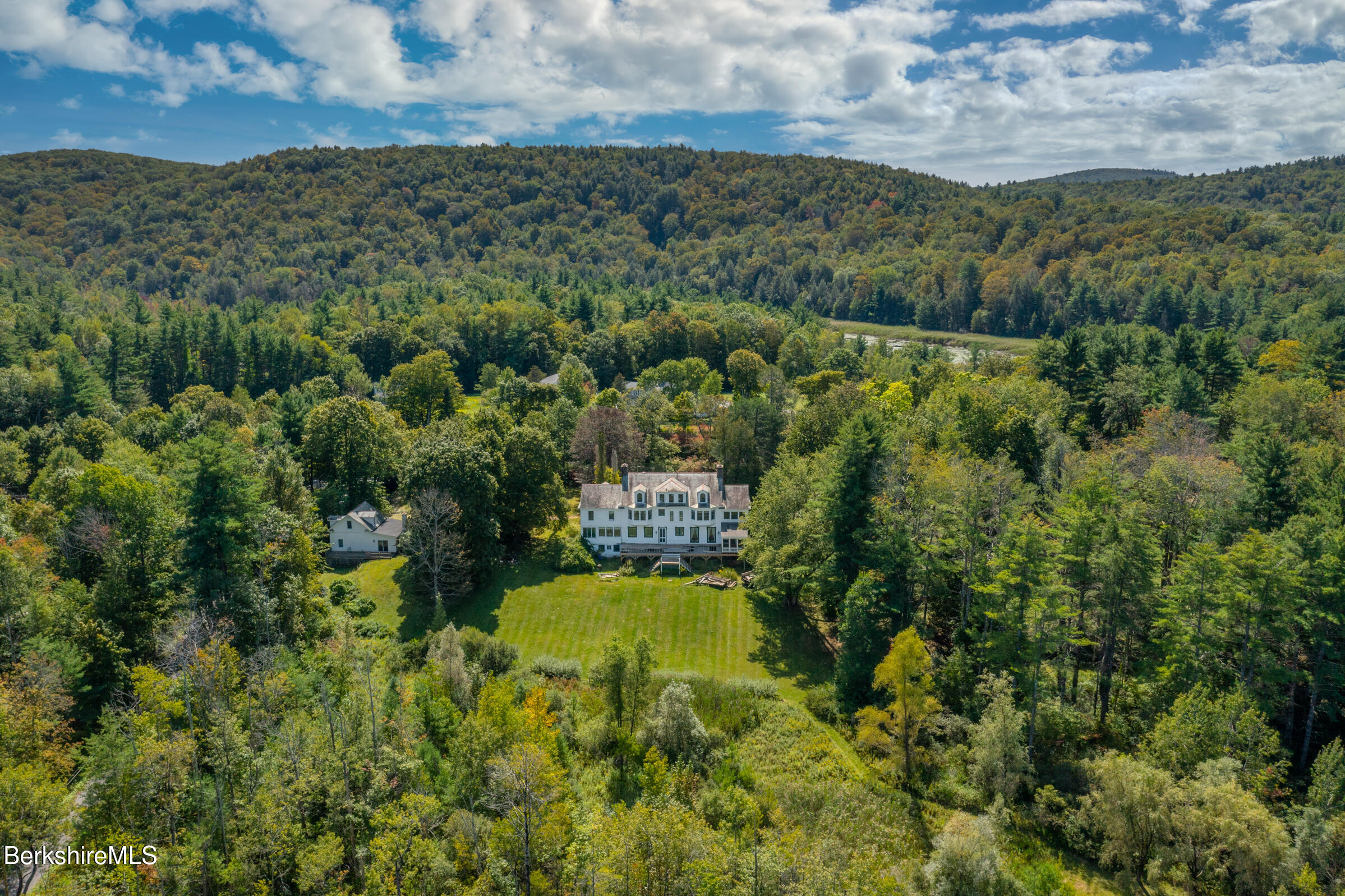 535 Main Road Monterey, MA 01245 - Photo 5 of 45 a view of a city with lush green forest