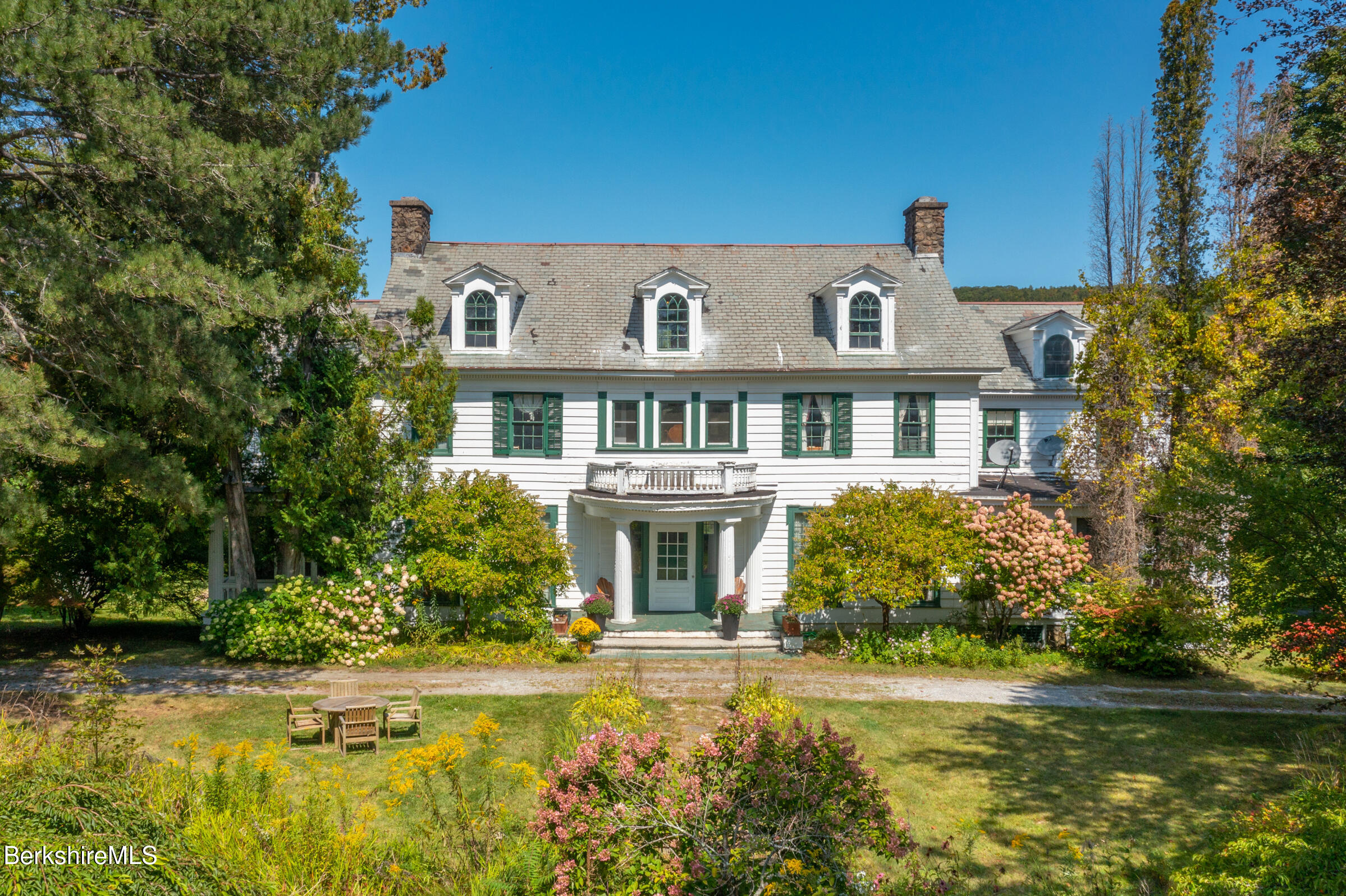 535 Main Road Monterey, MA 01245 - Photo 5 of 45 a front view of a house with swimming pool