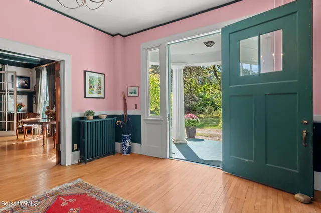 a living room with a couch and a book shelf