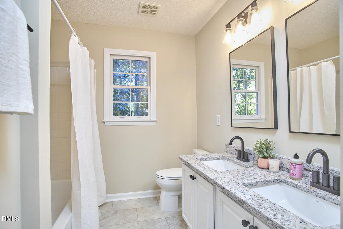 2800 Shofield Court Raleigh, NC 27615 - Photo 24 of 38 26 - Second Floor Hall Bath
