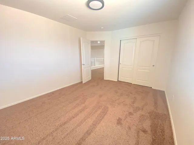 a bathroom with a double vanity sink mirror and shower