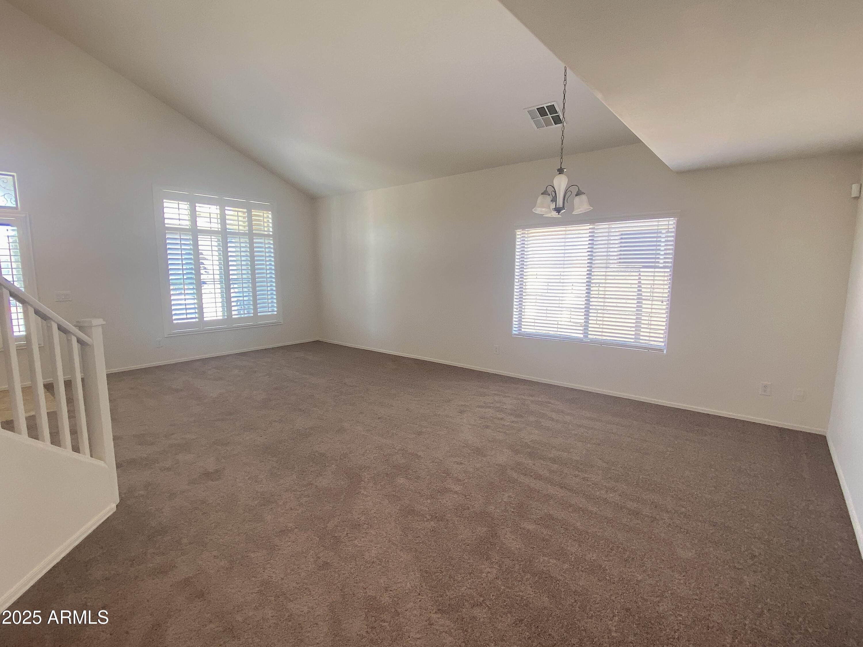 2036 West Quick Draw Way San Tan Valley, AZ 85144 - Photo 4 of 19 a view of an empty room with a window