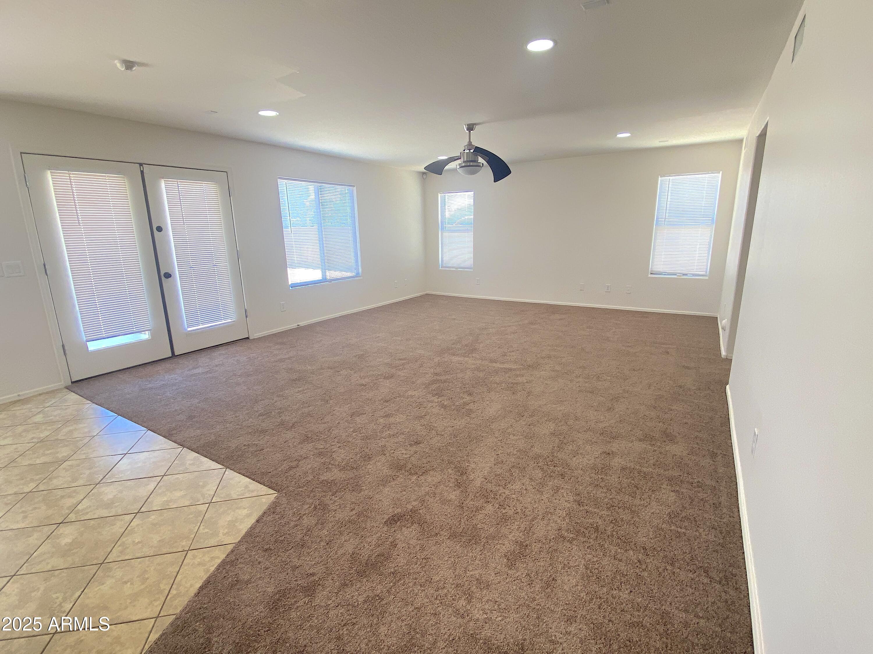 2036 West Quick Draw Way San Tan Valley, AZ 85144 - Photo 8 of 19 an empty room with windows and closet